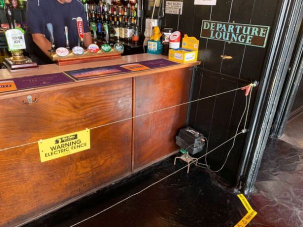 UK pub uses electric fence to enforce social distancing